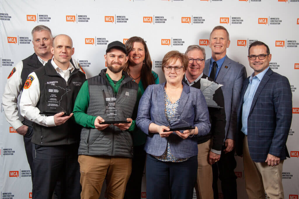 Celebrating their Award of Excellence from the Minnesota Construction Association for Bloomington Fire Station No. 4 at the awards ceremony on January 24: (rear row, left to right) Jay Forster, Bloomington assistant fire chief; Anya Beck, Terra Construction project manager; Bloomington Mayor Tim Busse; (front row, left to right) Tim Barrett, Bloomington deputy fire chief; Braden Koeppe Terra Construction field superintendent; Deb Williams, Bloomington assistant maintenance superintendent; Quinn Hudson, CNH; and Ben Newlin, Terra Construction project executive.
